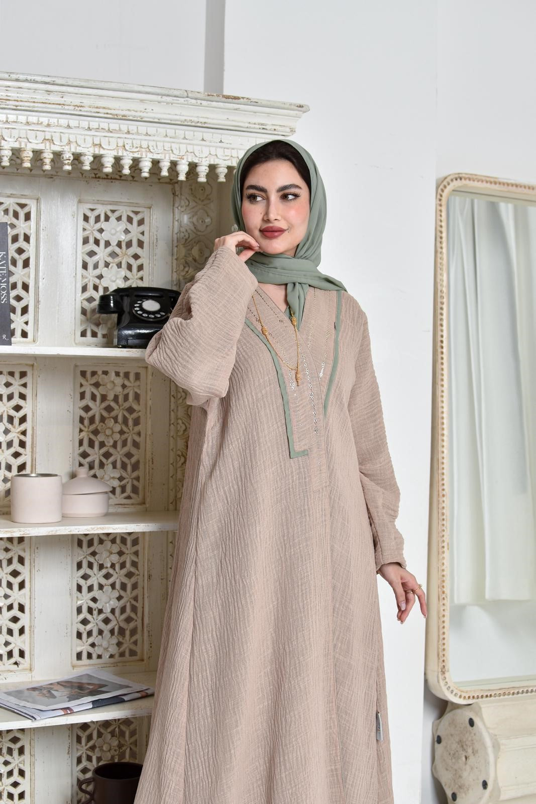 Beige crepe abaya lined with green chiffon embroidered with gold Bahraini Naghda art
