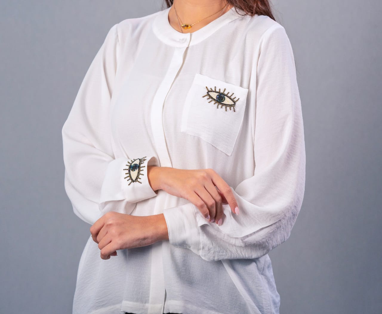 Modern free size shirt with front buttons, hand-embroidered (prominent eye)