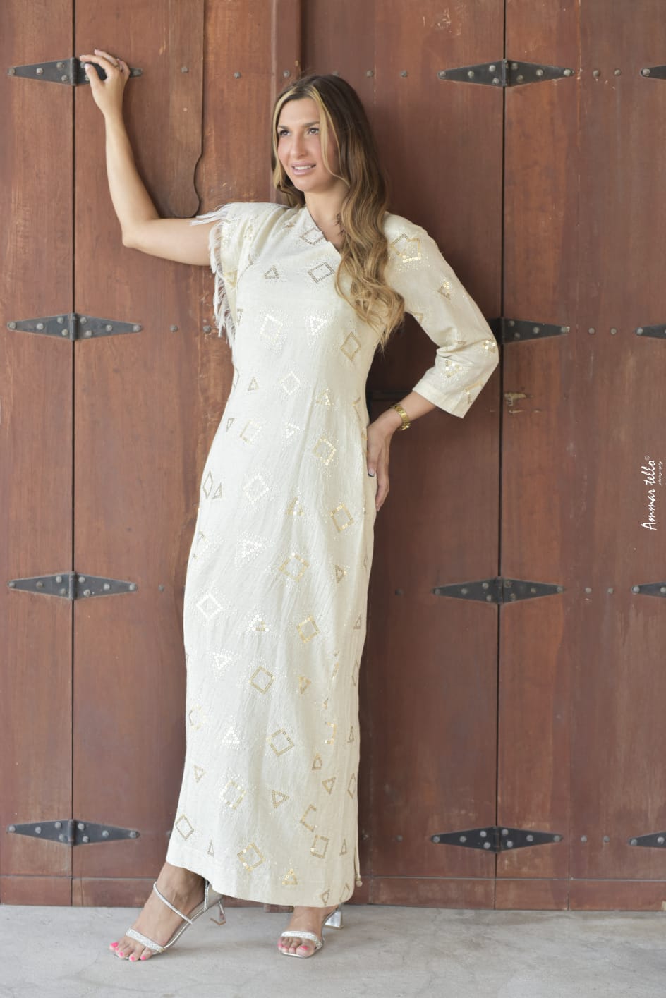 Beautiful modern dress with folk embroidery in geometric shapes with one sleeve